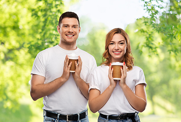 Image showing portrait of happy couple with takeaway coffee cups