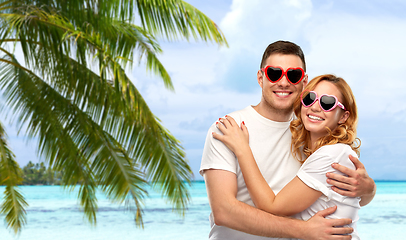 Image showing happy couple in white t-shirts and sunglasses