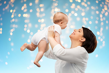 Image showing happy middle-aged mother with little baby daughter