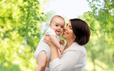 Image showing happy middle-aged mother with little baby daughter