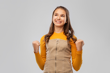 Image showing happy young teenage girl celebrating success