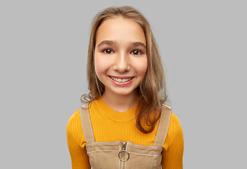 Image showing smiling teenage girl over grey background