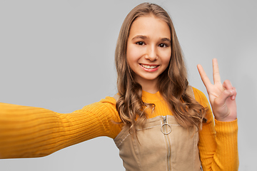 Image showing happy teenage girl taking selfie