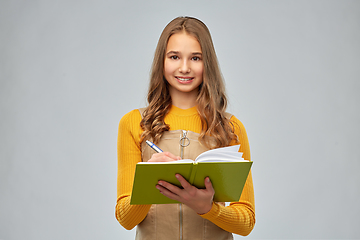 Image showing teenage student girl with notebook or diary