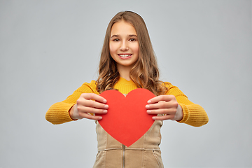 Image showing smiling teenage girl with red heart