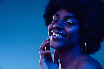 Image showing Portrait of female high fashion model in neon light