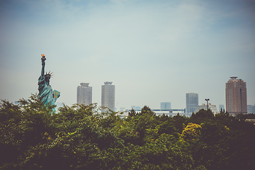 Image showing Statue of liberty and tokyo cityscape, Japan