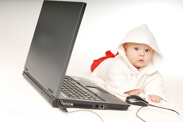 Image showing Baby and notebook