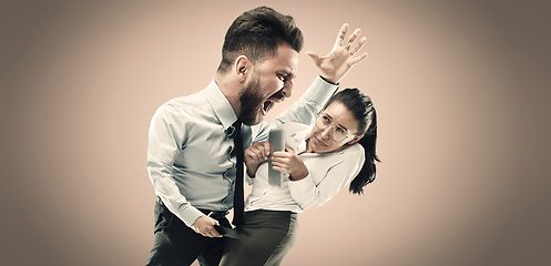 Image showing Angry business man screaming at employee in the office