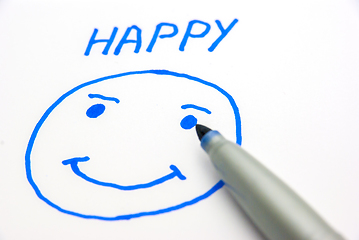 Image showing Drawing a happy face on paper