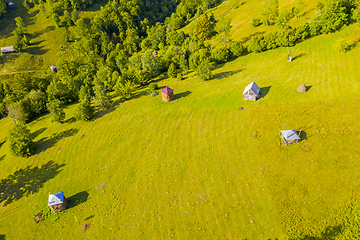 Image showing Aerial view of pasture and haystacks