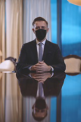 Image showing business man wearing protective face mask at luxury office