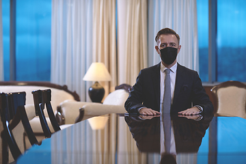 Image showing business man wearing protective face mask at luxury office