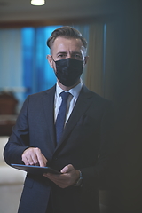 Image showing business man wearing protective face mask at office