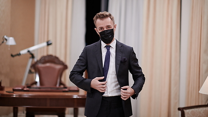 Image showing business man wearing protective face mask at office