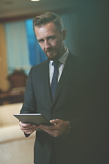 Image showing business man using tablet computer