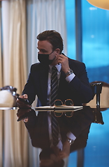 Image showing business man wearing protective face mask at office