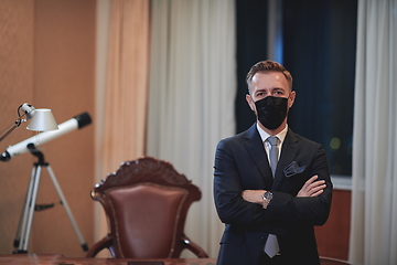 Image showing business man wearing protective face mask at office