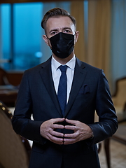 Image showing business man wearing protective face mask at office
