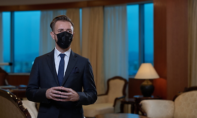 Image showing business man wearing protective face mask at office