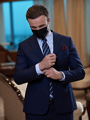 Image showing business man wearing protective face mask at office