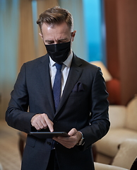 Image showing business man wearing protective face mask at office