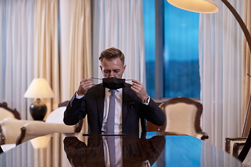 Image showing business man wearing protective face mask at office