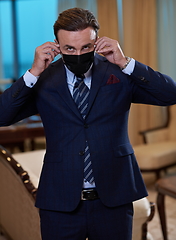 Image showing business man wearing protective face mask at office