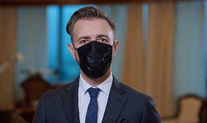 Image showing business man wearing protective face mask at office