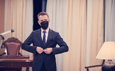 Image showing business man wearing protective face mask at office