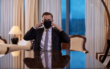 Image showing business man wearing protective face mask at office