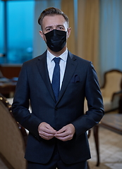 Image showing business man wearing protective face mask at office