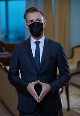 Image showing business man wearing protective face mask at office