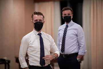 Image showing business team wearing crona virus protection face mask