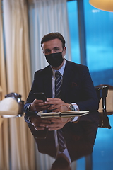 Image showing business man wearing protective face mask at office