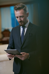 Image showing business man using tablet computer