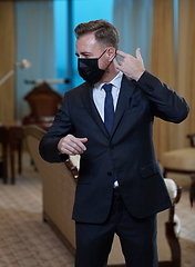 Image showing business man wearing protective face mask at office