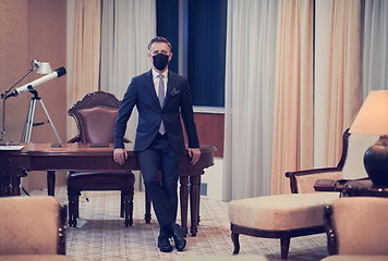 Image showing business man wearing protective face mask at office