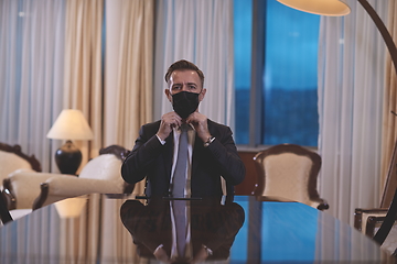 Image showing business man wearing protective face mask at office