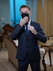 Image showing business man wearing protective face mask at office