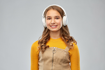 Image showing teenage girl in headphones listening to music