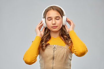 Image showing teen girl in headphones listening relaxing music