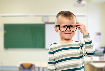 Image showing portrait of smiling boy in glasses at school