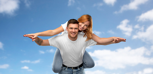 Image showing happy couple in white t-shirts having fun