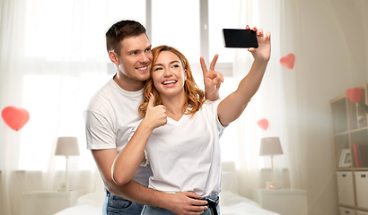 Image showing happy couple taking selfie on valentines day