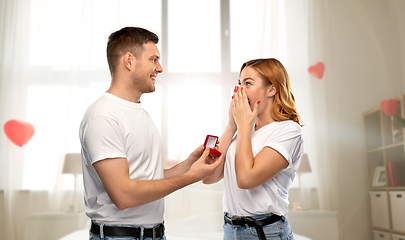 Image showing man giving woman engagement ring on valentines day