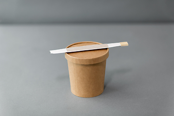 Image showing paper container for takeaway food with chopsticks