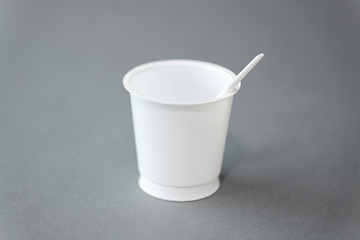 Image showing white disposable plastic cup with spoon