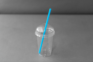 Image showing white disposable plastic cup with spoon