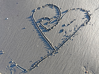 Image showing Love heart on sandy beach